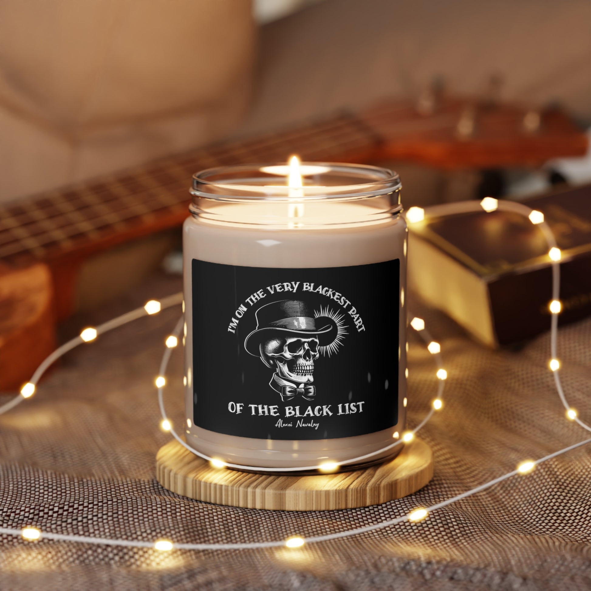 9 ounce glass jar scented soy candle with edgy design, skull graphic and quote from Navalny "I'm on the very blackest part of the black list"