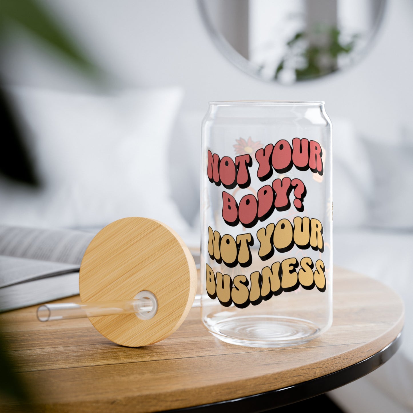 Pro-choice 16 ounce glass sipper cup for coffee or tea. Support a woman's right to choose. "Not Your Body, Not Your Business" design with small, cute graphics.