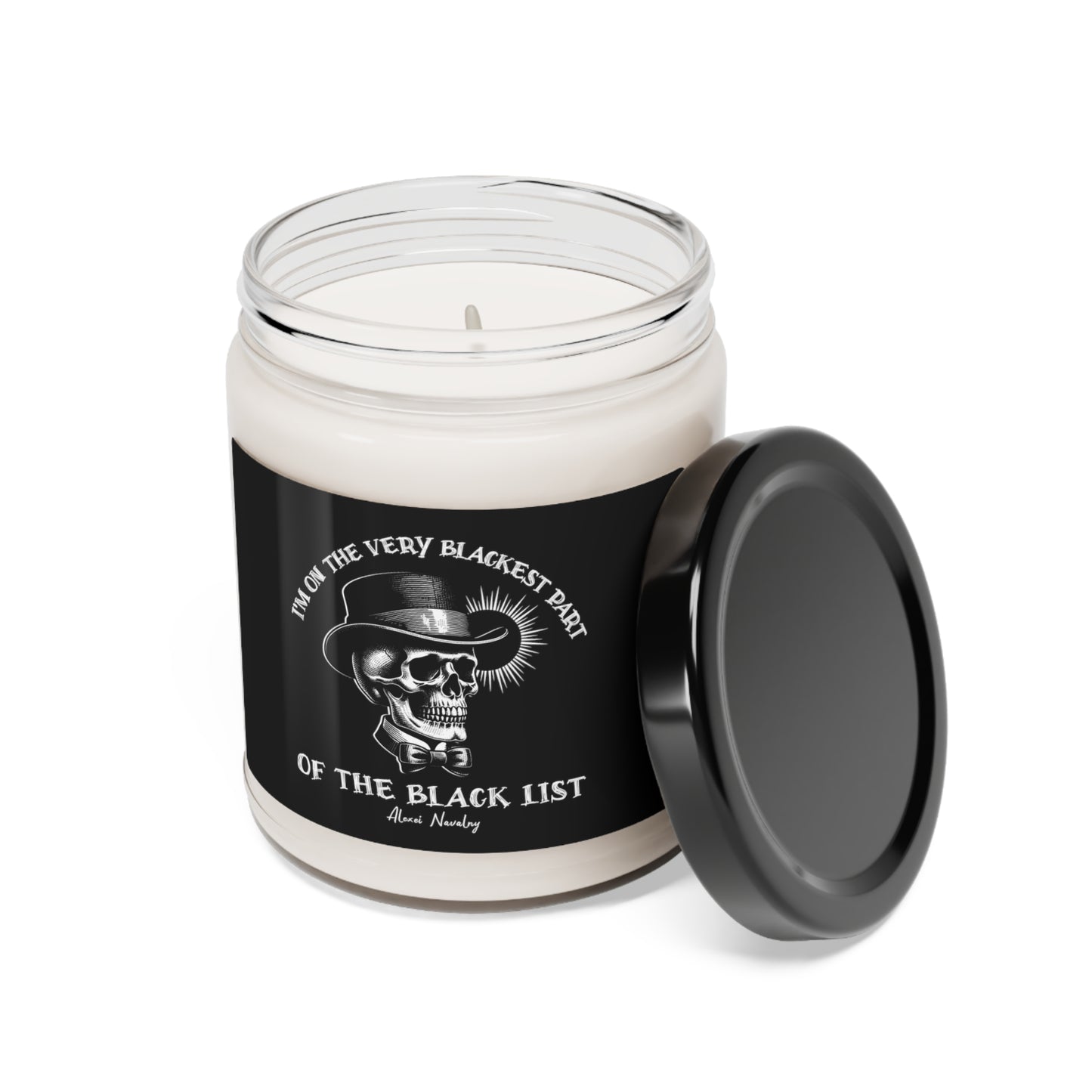 Glass jar scented soy candle with black lid. Black label with skull design and Navalny quote.