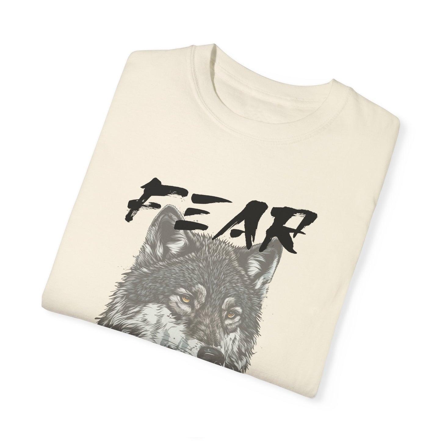 Ivory Comfort Colors t-shirt with a wolf graphic and the phrase: Fear Makes The Wolf Bigger Than It Is. Ideal gift for anyone struggling with fearful challenges to motivate and inspire. 