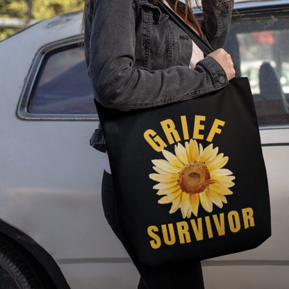 Black Grief Survivor tote bag. Excellent for carrying those important documents, when you are handling the details of a lost loved one. Or simply a carryall for daily errands or school books, with a message to inspire and uplift you during a difficult time of loss.