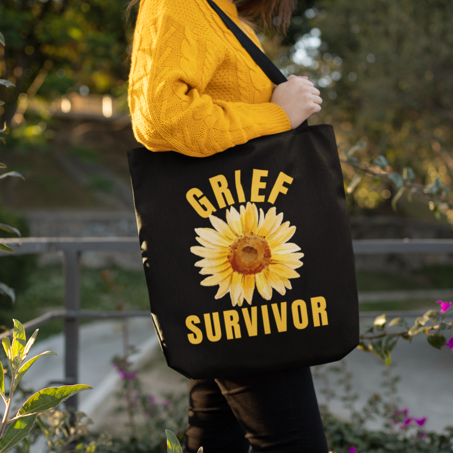 Black Grief Survivor Tote bag. Ideal for carrying those important documents needed when handling the details for a lost loved one. Or simply a carryall for running errands or holding books, with a message of comfort and resilience. 