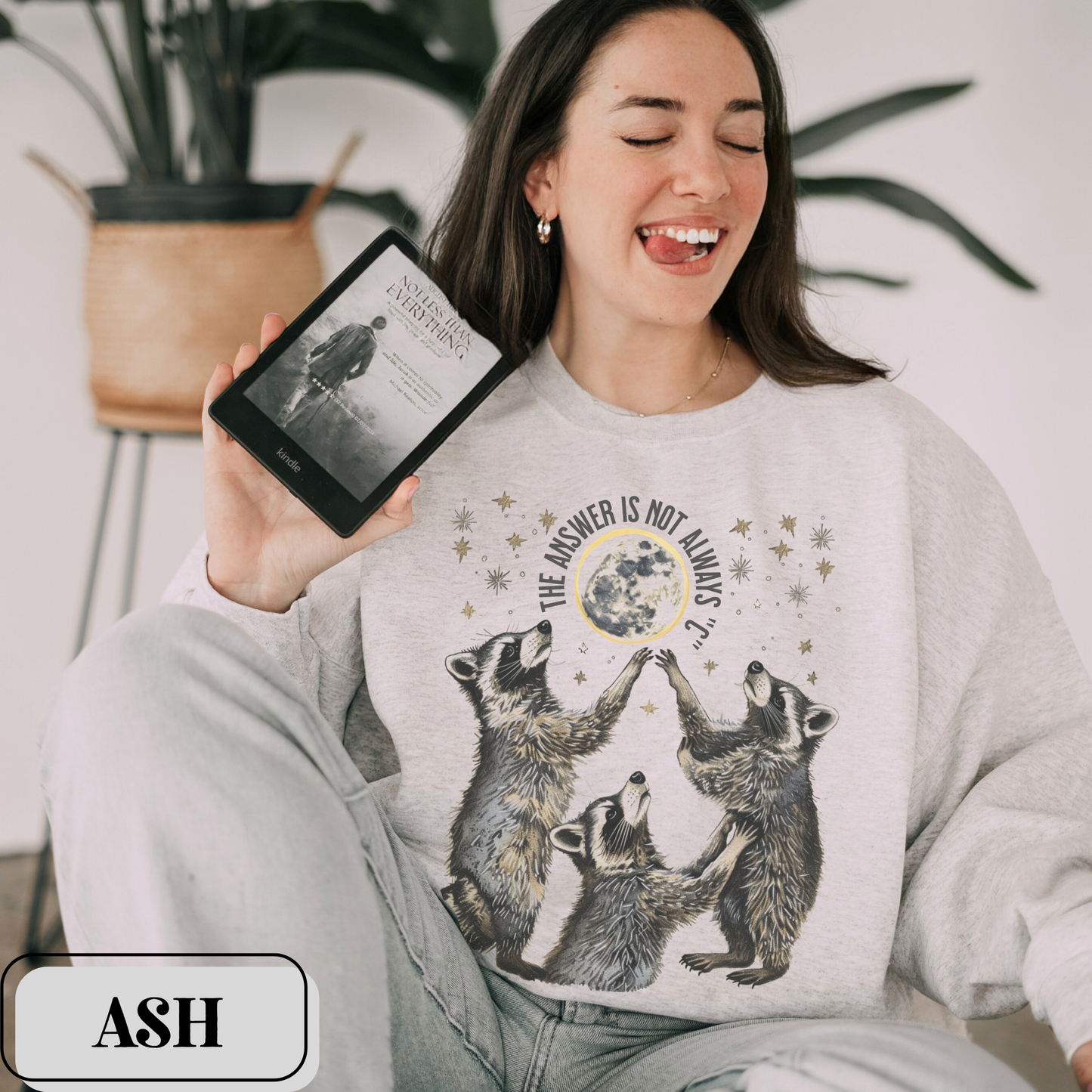 Ash Gildan 18000 Sweatshirt with large raccoon and moon/stars graphic that says "The Answer Is Not Always 'C'" - funny meme crewneck for teachers. Great gift for education grad or major, new teacher, educators, etc. Weird teachers goblincore.