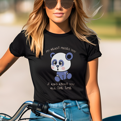 Black Bella Canvas 3001 t-shirt featuring a sad teddy bear with the message: My Heart Misses You. It asks About You All The Time. This is more than just a piece of clothing; it's a tender declaration of love and longing.