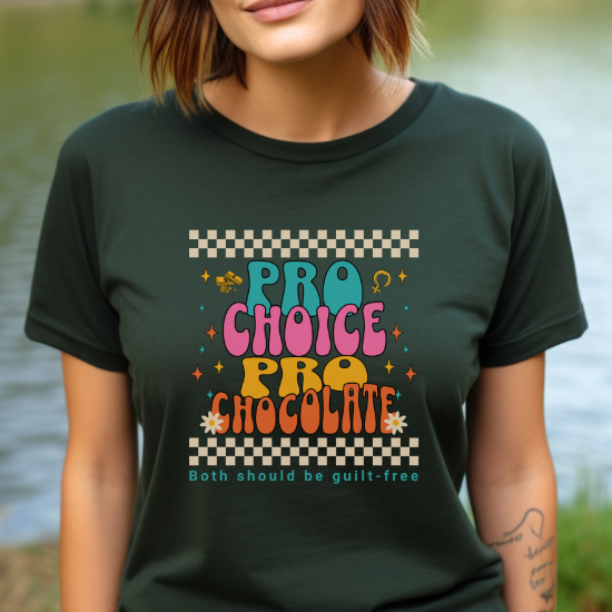 Forest green pro-choice tee features a trendy checkered border and colorful retro lettering, along with a cheeky slogan, to promote a serious message of support for a women's right to choose. 