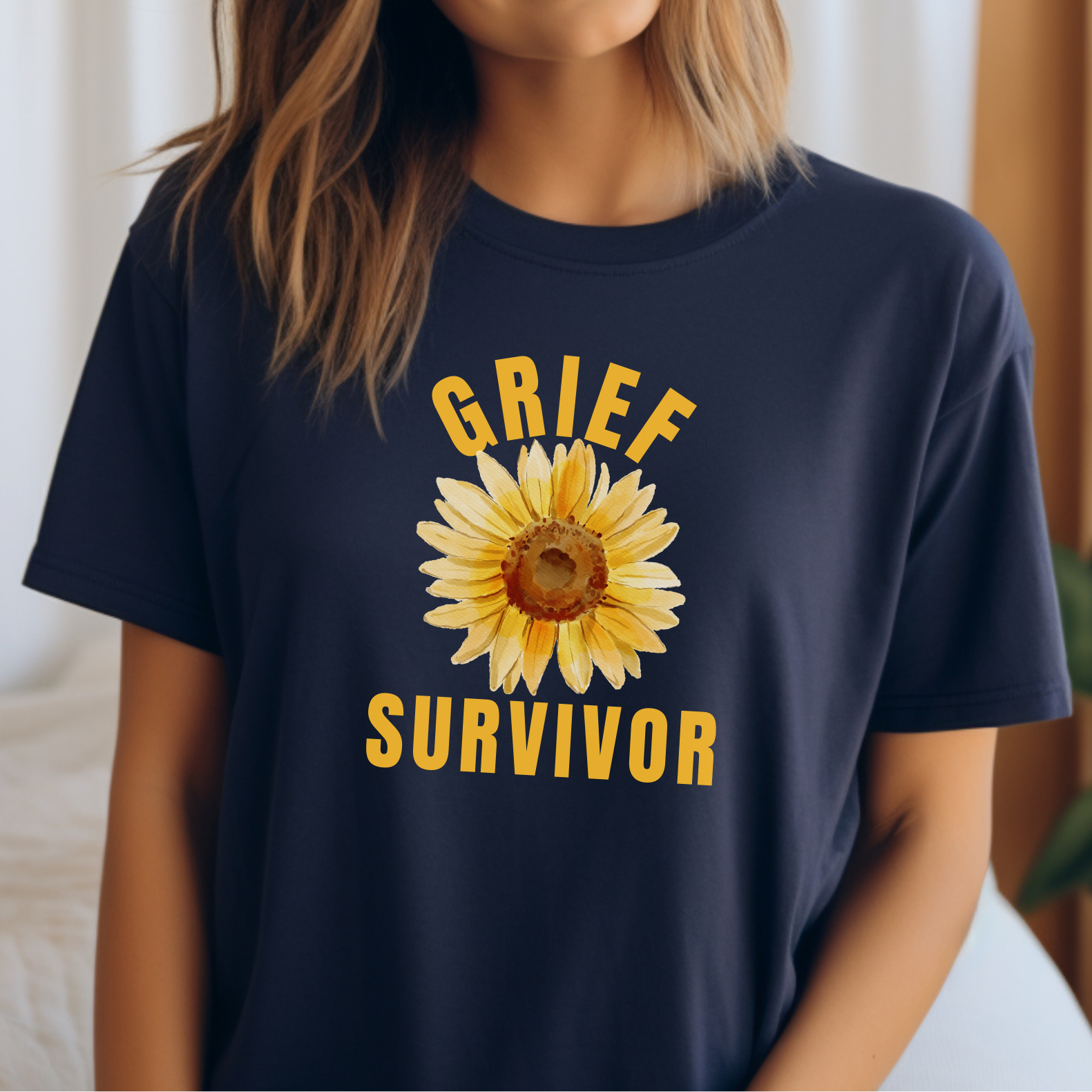 Navy Bella Canvas 3001 tee. This t-shirt showcases a simple sunflower design paired with the message Grief Survivor, serving as a symbol of endurance and healing