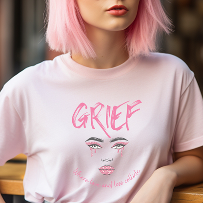 Soft Pink Bella Canvas 3001 Tee. Honor your grief journey with this stunning graphic design featuring a crying face and the phrase: Grief, Where Love and Loss Collide