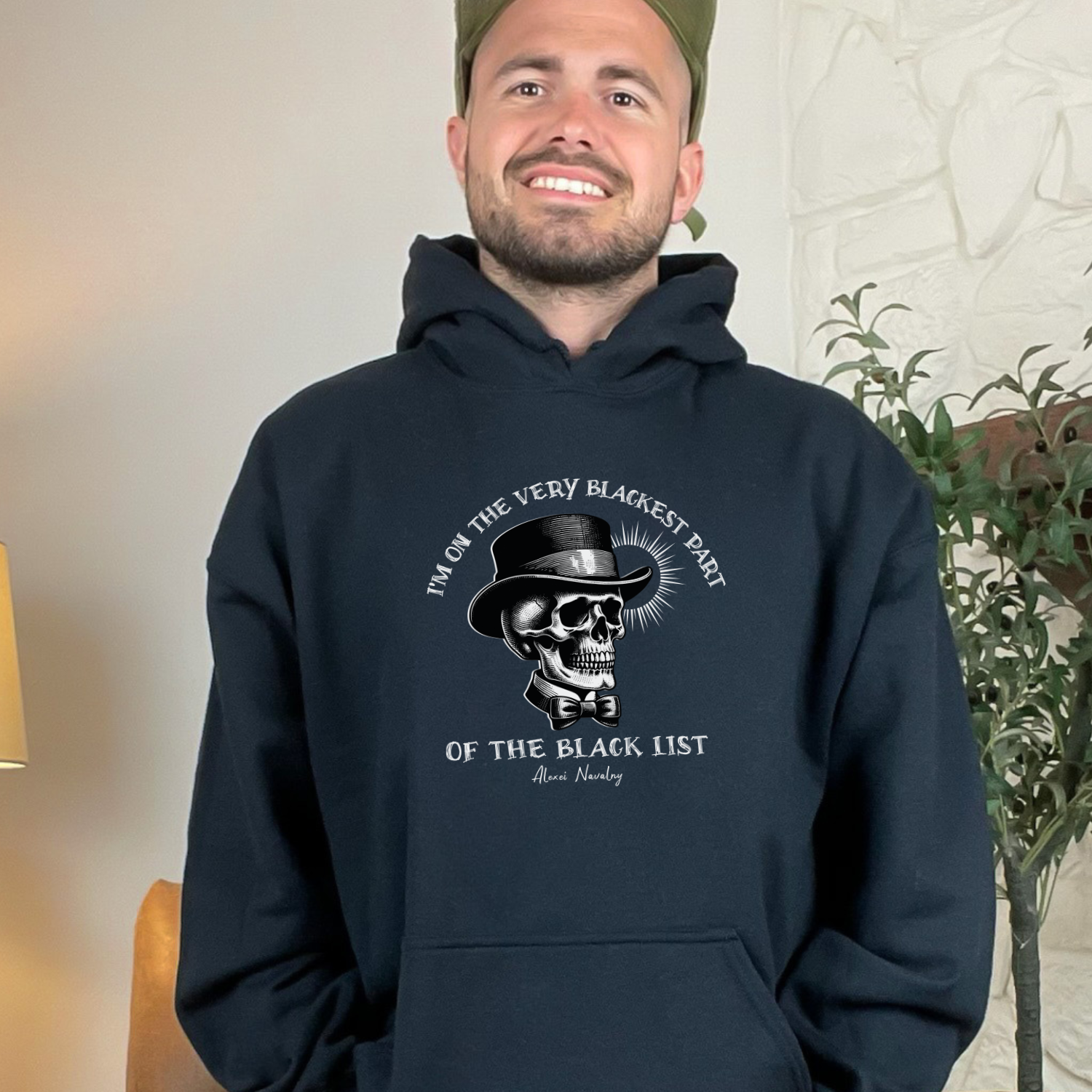 Black hoodie with Alexei Navalny's powerful quote, 'I'm on the very blackest part of the black list,' that stands as a symbol of resistance and courage. Gildan 18500 hooded sweatshirt.