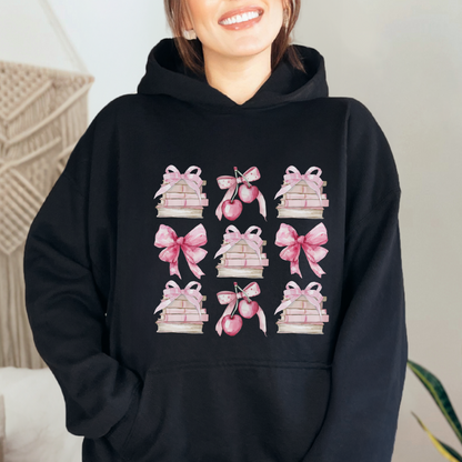 Black Gildan 18500 Hoodie sweatshirt with a coquette pink design. Filled with books, bows and cherries, it's the perfect gift for the avid reader, book lover, librarian, or English/Reading teacher, student, graduate in your life. Makes a great reading outfit idea.