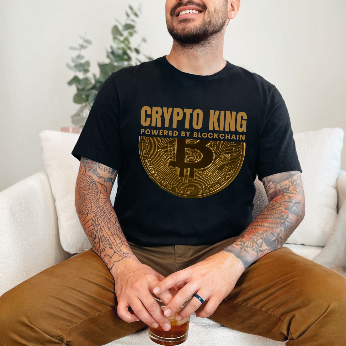 Black Crypto King Bella Canvas 3001 T-shirt with a large gold Bitcoin graphic - "Powered By Blockchain". Perfect gift for men in finance, crypto currency investors, team Satoshi and Saylor supporters, anyone who believes the future of banking is in digital currency.