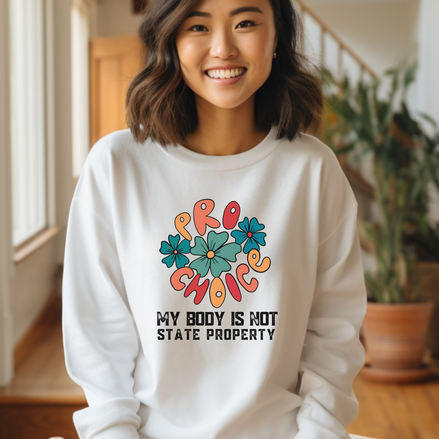 White is the perfect background for this colorful retro design on a Comfort Colors 1566 sweatshirt with a powerful pro-choice message. 