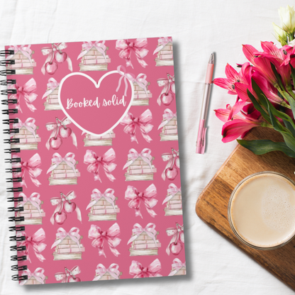 "Booked Solid" coquette style spiral notebook for reading lover, writer, bibliophile. Perfect for school notes, shopping lists, to be read lists, and so much more. Makes a great gift for avid readers, teachers and librarians.