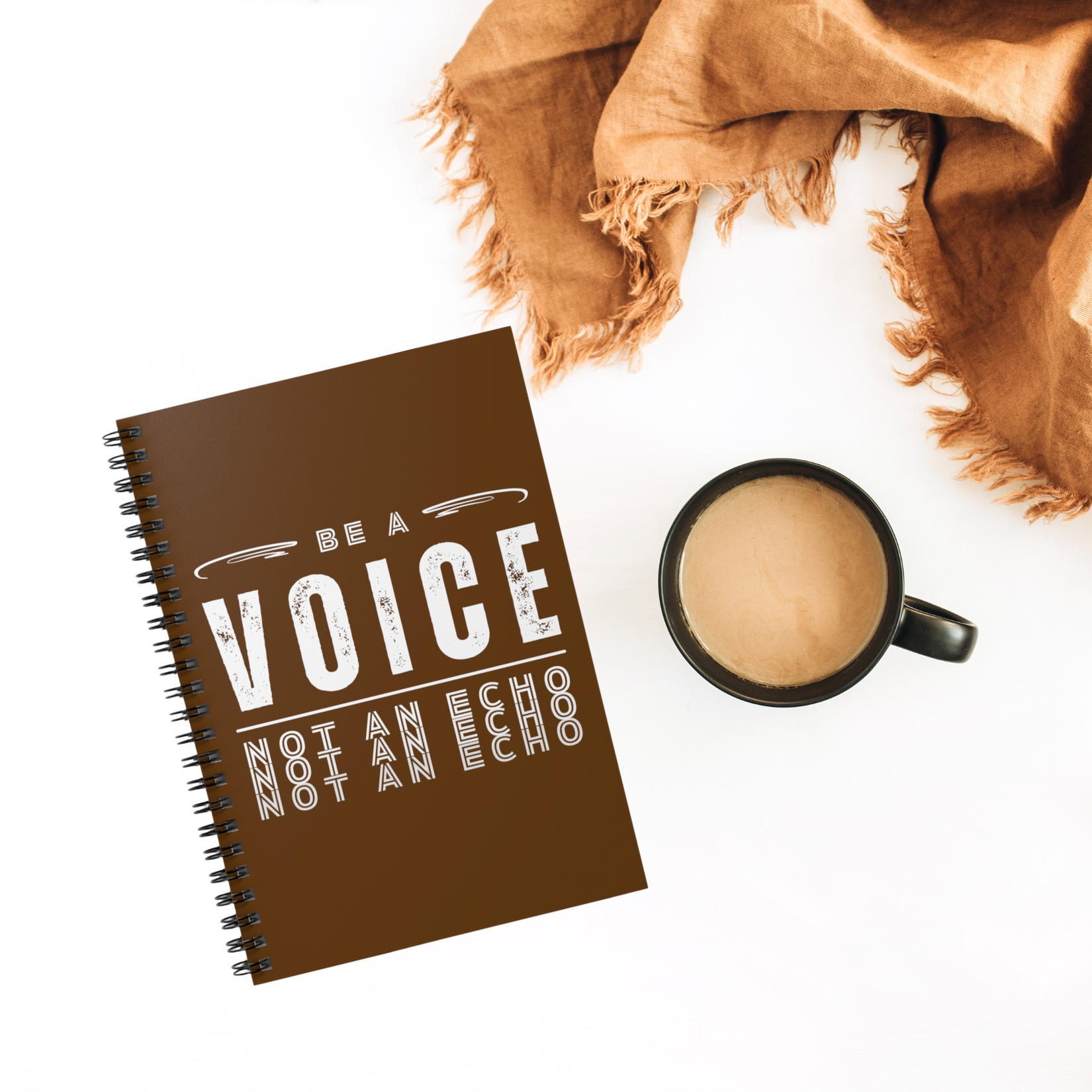 Brown spiral notebook with 118 lines pages. Front cover includes design with the phrase "Be a Voice, Not an Echo"