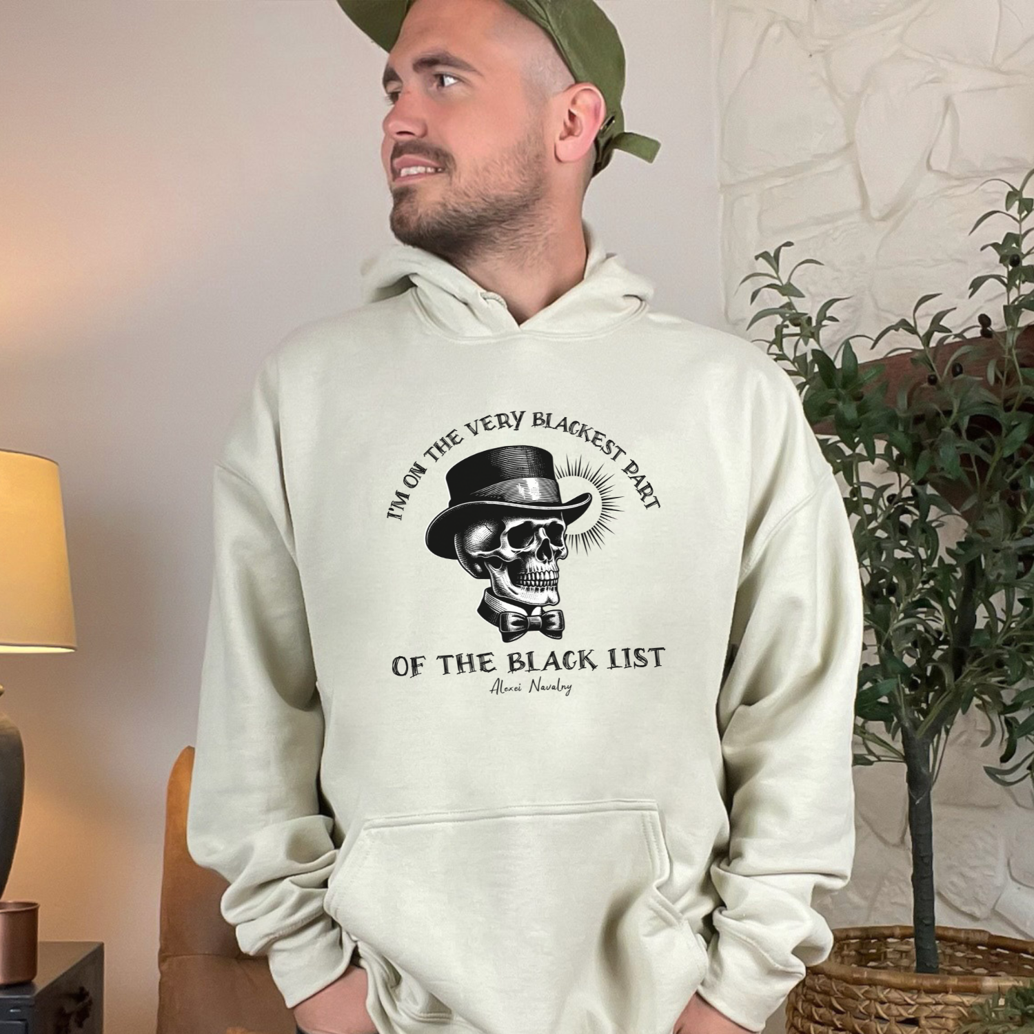 A sand colored hoodie, adorned with Navalny's quote "I'm on the very blackest part of the black list", stands to embody the spirit of defiance and the quest for political freedom.