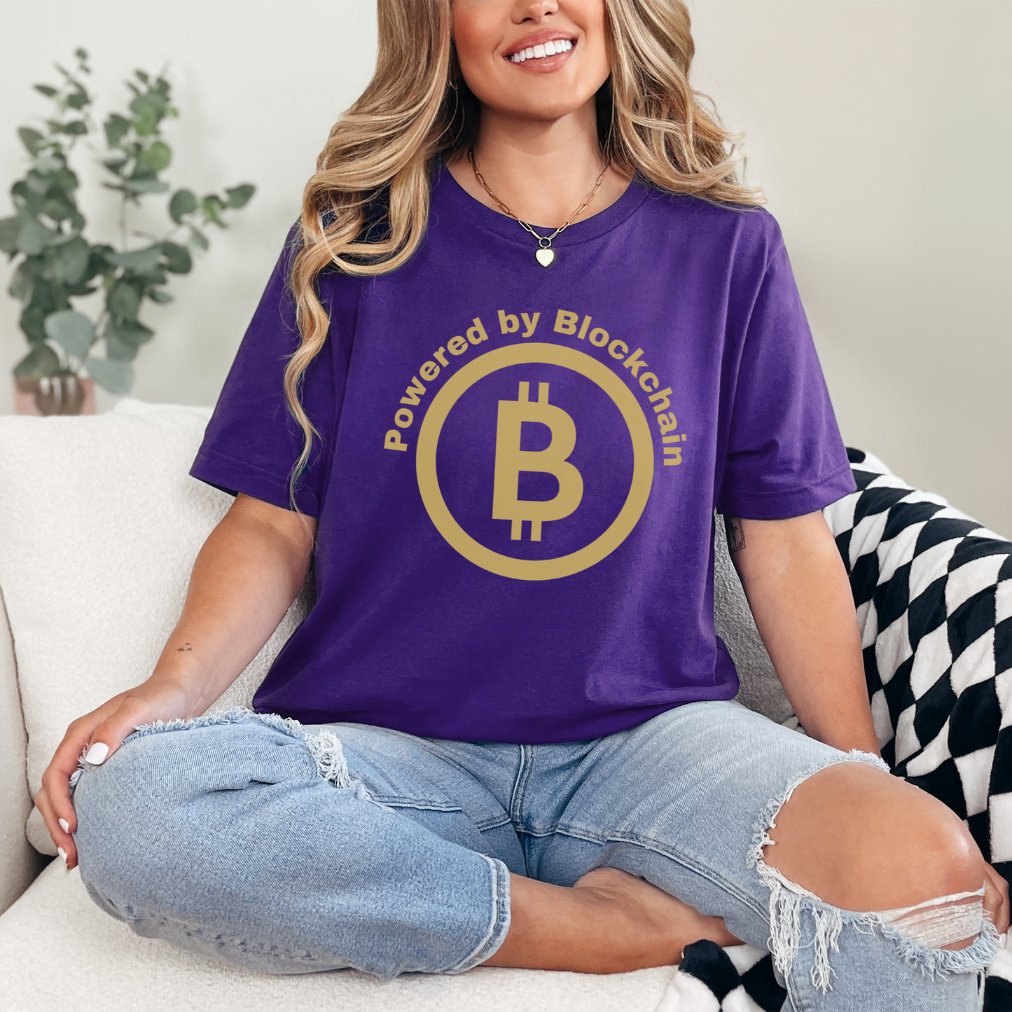 Team Purple unisex Bella Canvas 3001 T-shirt that says "Powered by Blockchain" with a large Bitcoin on it. Makes a perfect couples shirt or gift for men or women in finance, crypto currency investors and supporters of Blockchain technology.