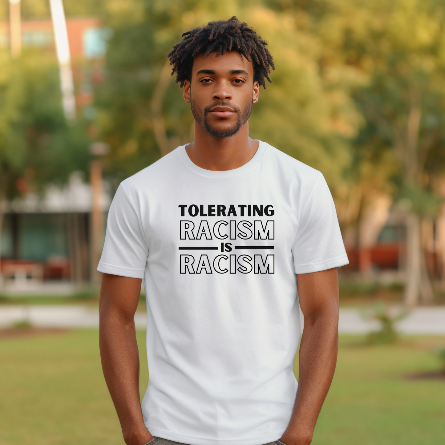 Make a bold statement for justice and equality with this tee that states, 'Tolerating racism is racism.' - Bella Canvas 3001 in white.