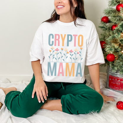 White Comfort Colors 1717 T-shirt that says "Crypto Mama" with a color set of flowers. Perfect gift for your wife, girlfriend, sister, or friend that works in finance and supports crypto currency. The future of banking is blockchain.