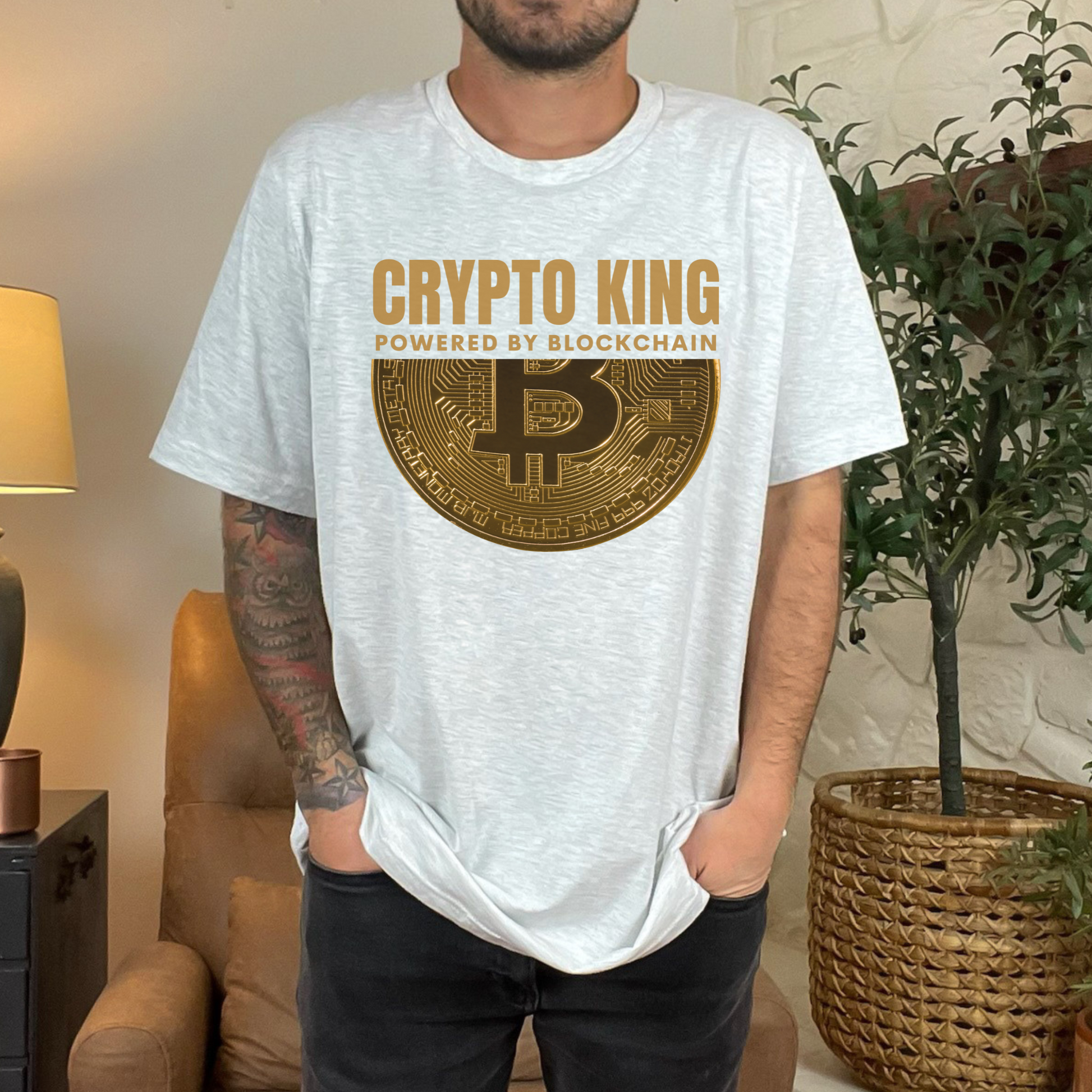 Ash Crypto King Bella Canvas 3001 T-shirt with a large gold Bitcoin graphic - "Powered By Blockchain". Perfect gift for men in finance, crypto currency investors, team Satoshi and Saylor supporters, anyone who believes the future of banking is in digital currency.