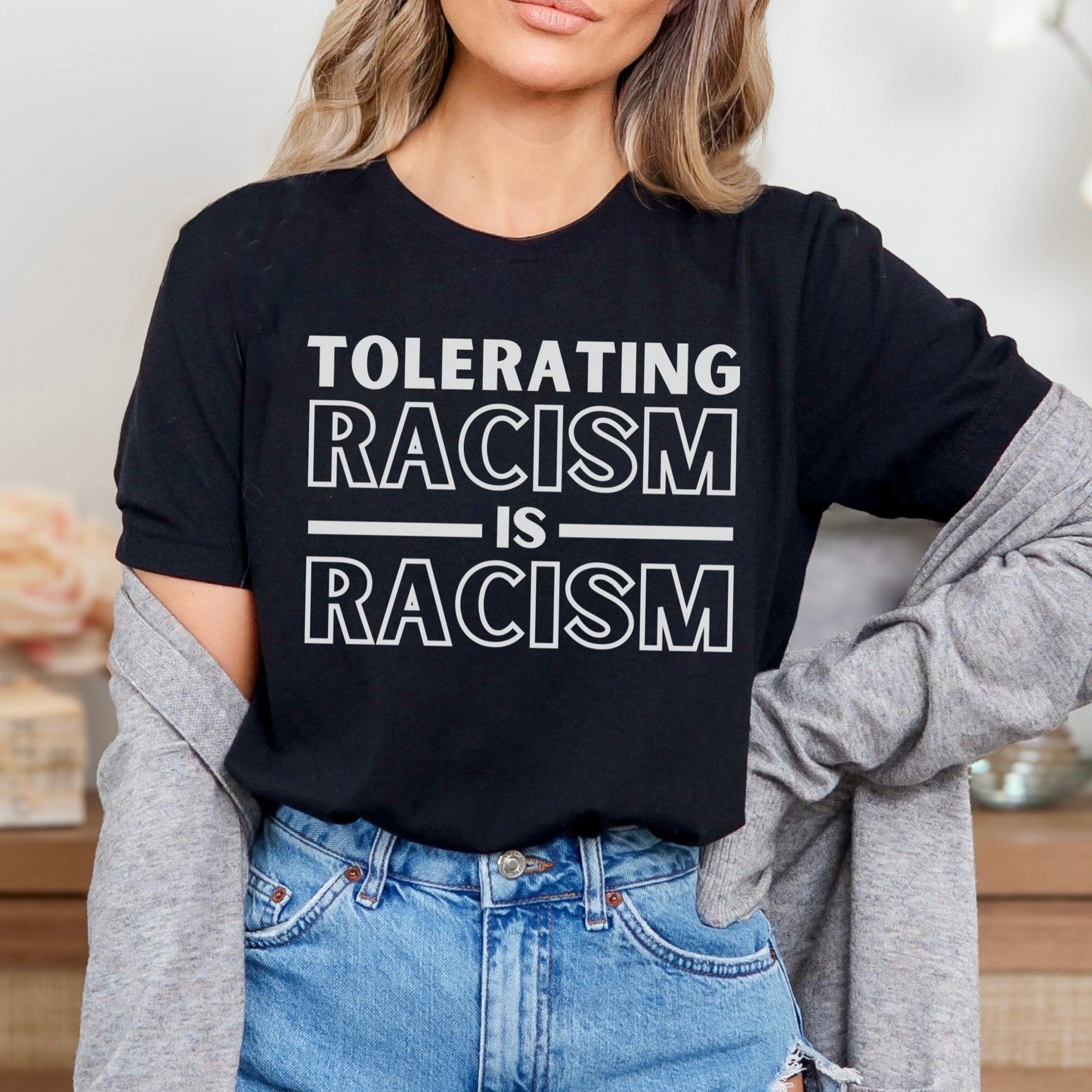 Black men's and women's bella canvas 3001 t-shirt that says Tolerating Racism Is Racism. Support the Black Lives Matter movement with this unisex t-shirt for activists, allies, immigrants, refugees, indigenous and asian Americans. Unique gift