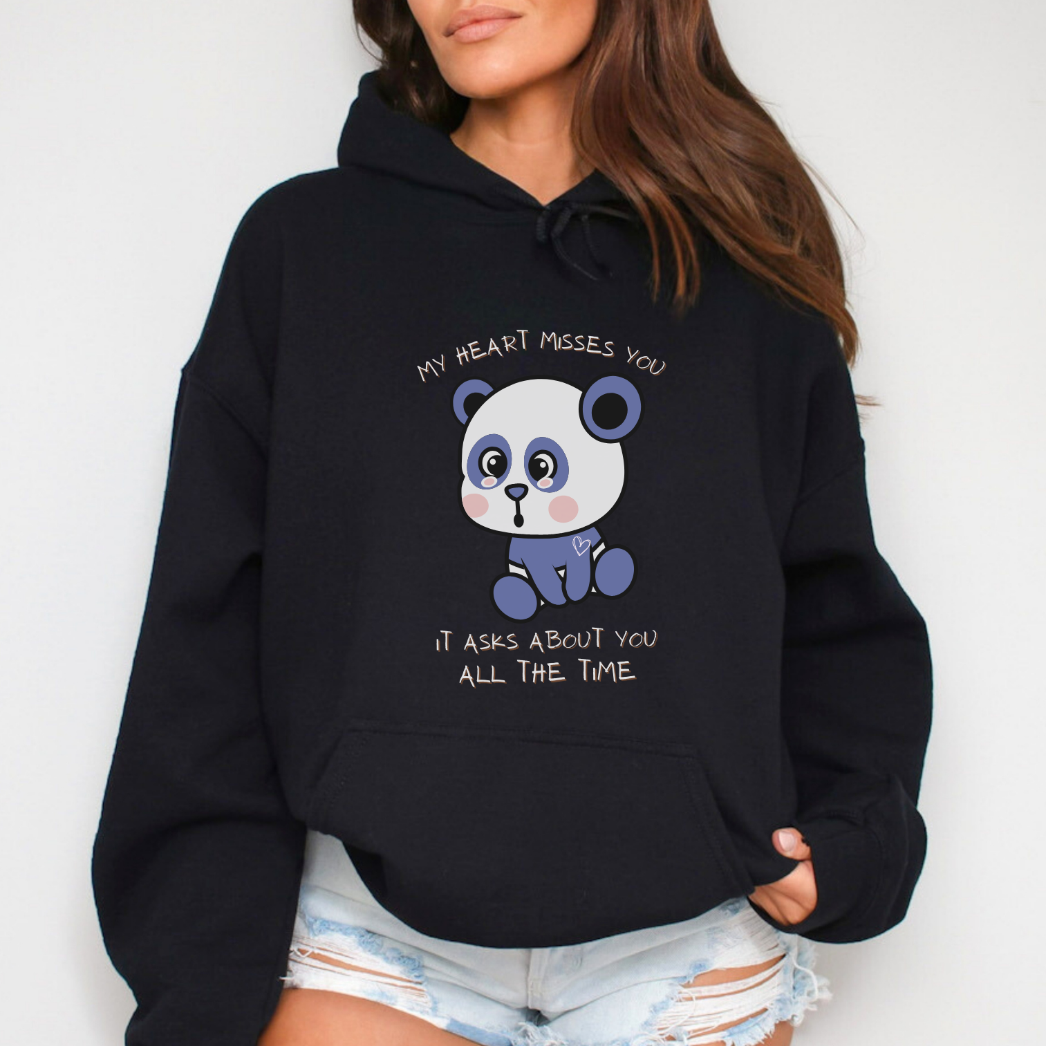 Wearable sentiment - "my heart misses you, it asks about you all the time" sweatshirt, with a lonely teddy bear that symbolizes love and loss. Color: Black