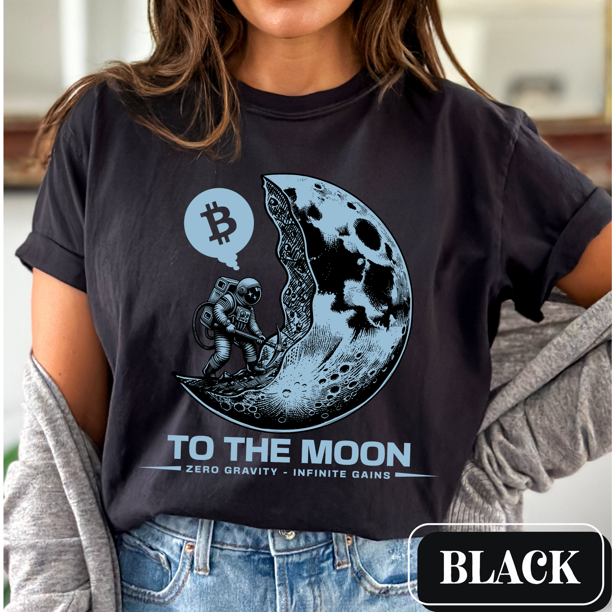 Black Comfort Colors 1717 T-Shirt with a large, edgy graphic of a moon and someone mining bitcoin. Perfect gift for crypto currency enthusiasts, traders, investors, and BTC lovers.