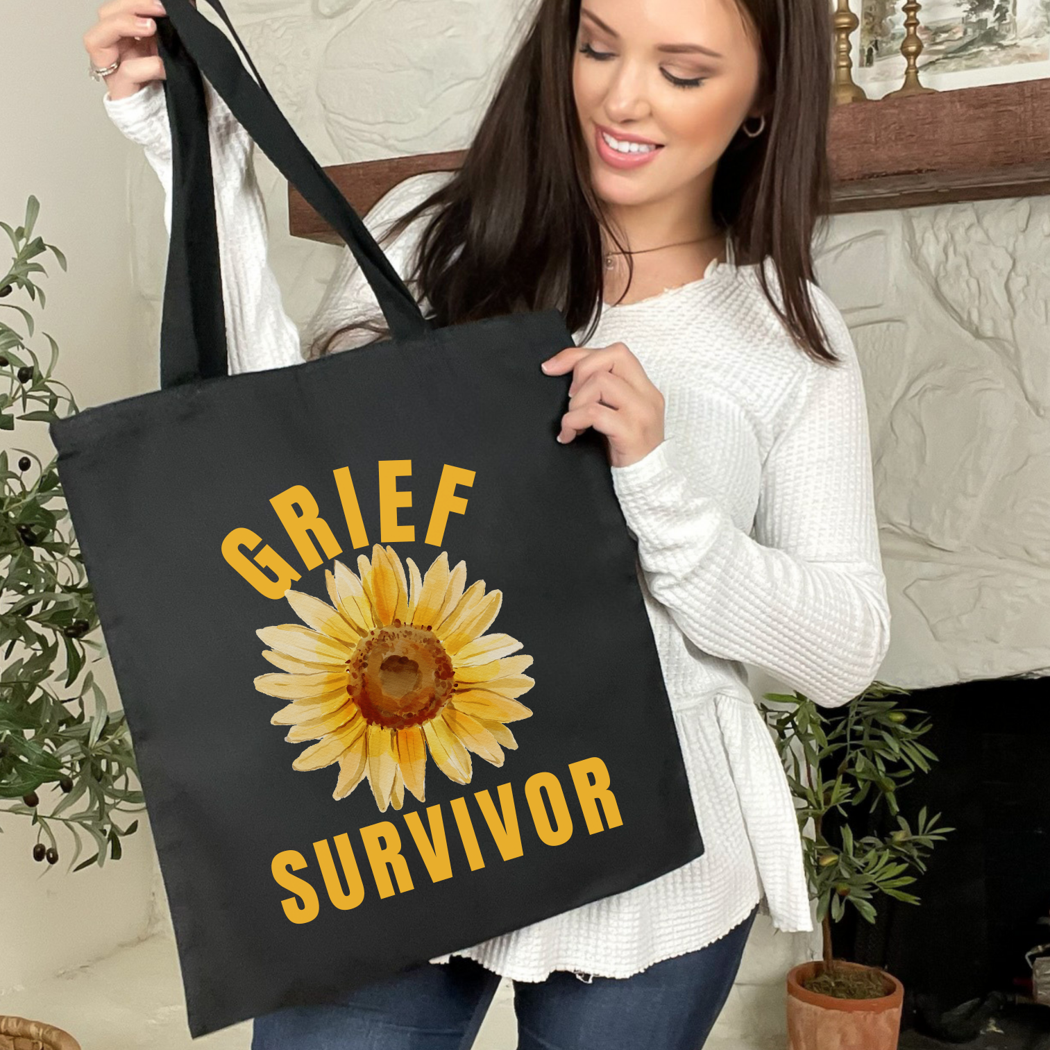 Black Grief Survivor Tote Bag with sunflower graphic. Unique and compassionate sympathy gift.