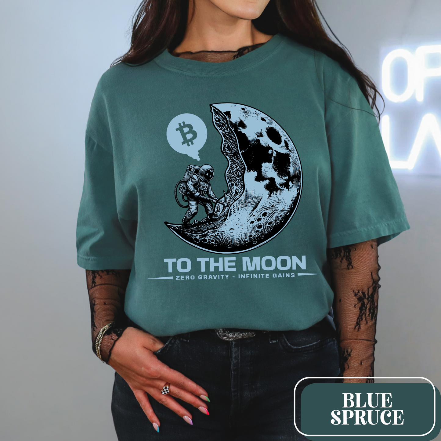 Blue Spruce Comfort Colors 1717 T-Shirt with a large, edgy graphic of a moon and someone mining bitcoin. Perfect gift for crypto currency enthusiasts, traders, investors, and BTC lovers.