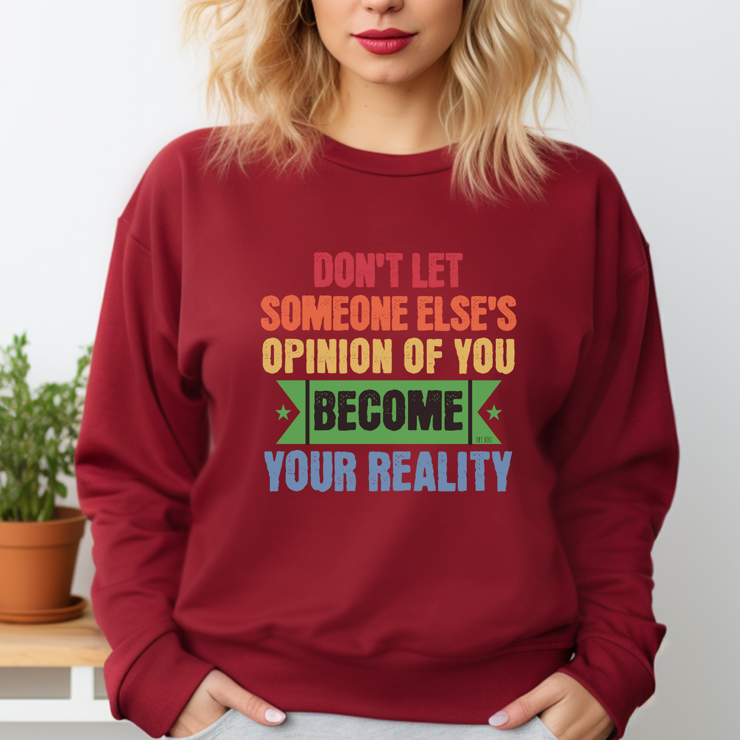 Garnet Gildan 18000 sweatshirt, with the persuasive message: Don't Let Someone Else's Opinion of You Become Your Reality. Live authentically.