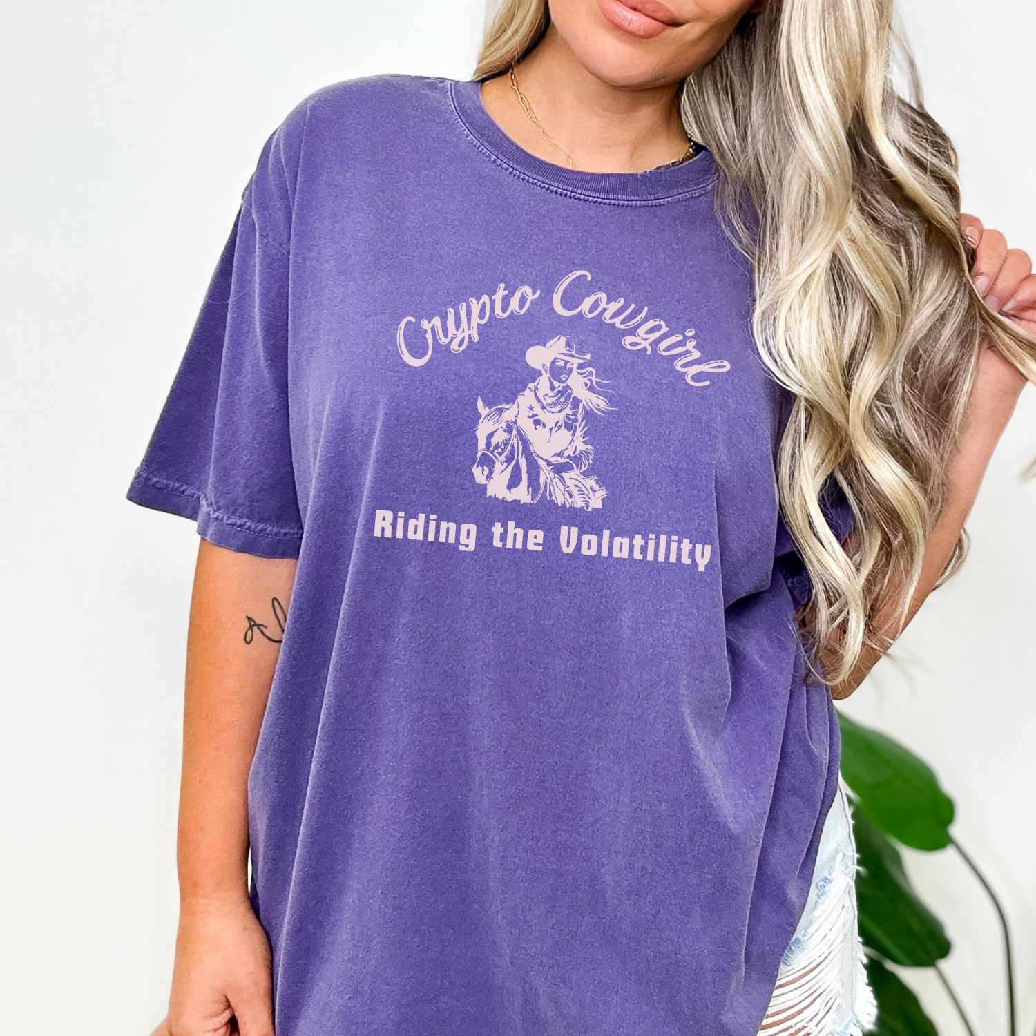Grape Crypto Cowgirl t-shirt. Crypto Mavericks Unite: Ride the Volatility Wave in style.