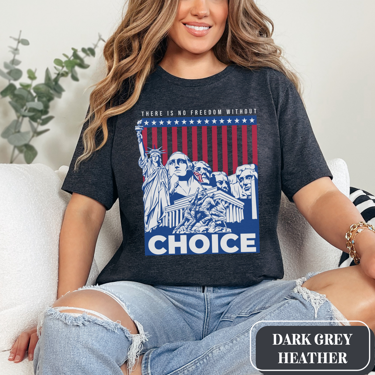 Dark Grey Heather Bella Canvas 3001 T-shirt with a patriotic design featuring the Statue of Liberty, Mount Rushmore, and an American Flag with soldiers. Women's fight for freedom is still ongoing - join us in advocating for a woman's right to choose and bodily autonomy. Support Roe V Wade.