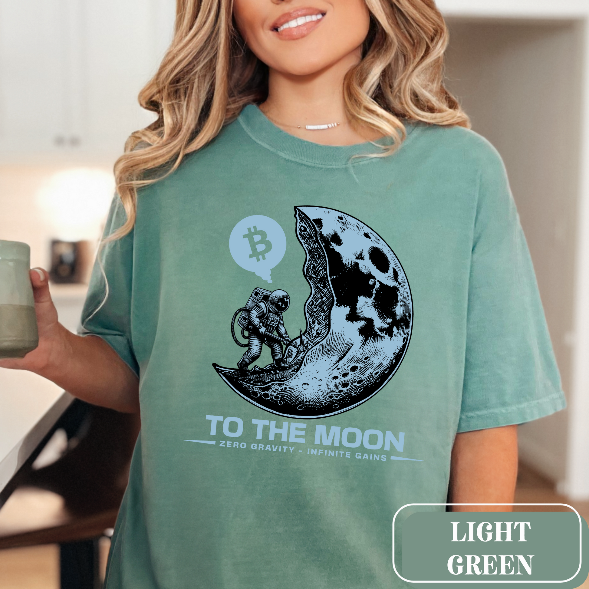 Light Green Comfort Colors 1717 T-Shirt with a large, edgy graphic of a moon and someone mining bitcoin. Perfect gift for crypto currency enthusiasts, traders, investors, and BTC lovers.