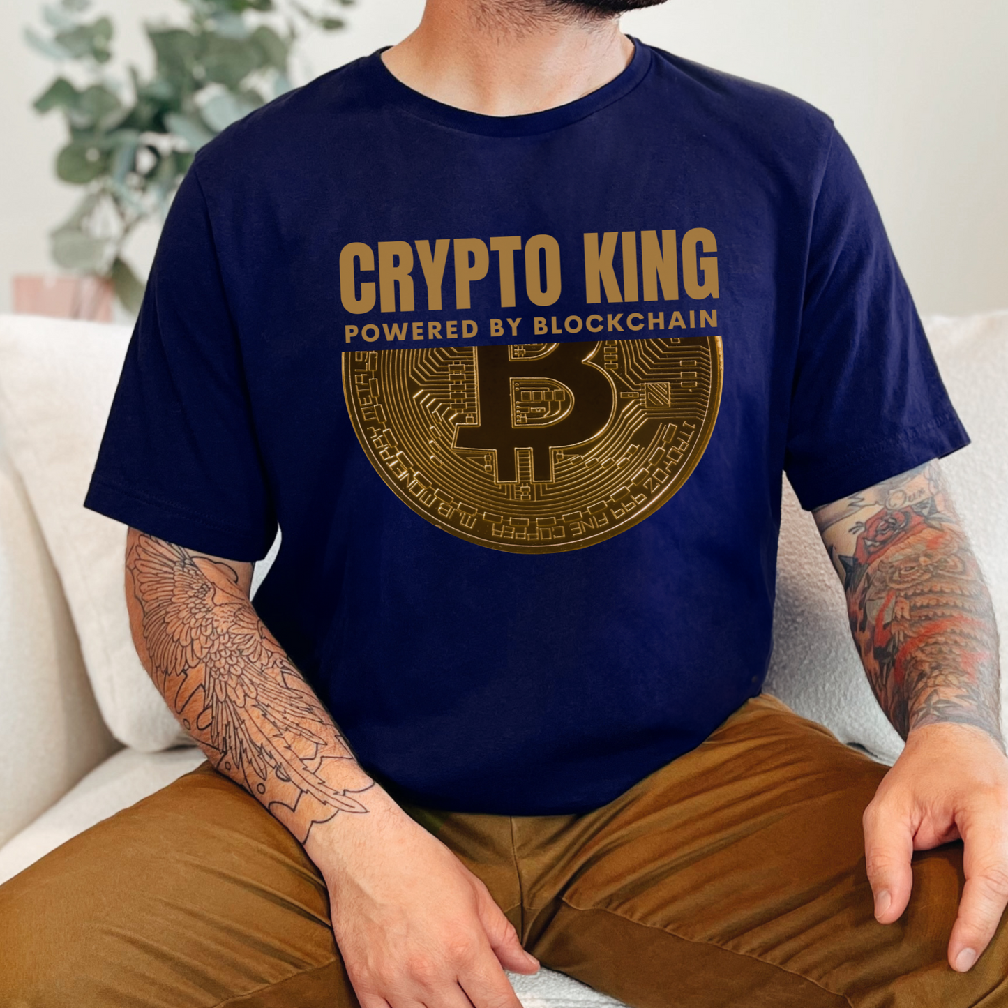 Navy Crypto King Bella Canvas 3001 T-shirt with a large gold Bitcoin graphic - "Powered By Blockchain". Perfect gift for men in finance, crypto currency investors, team Satoshi and Saylor supporters, anyone who believes the future of banking is in digital currency.