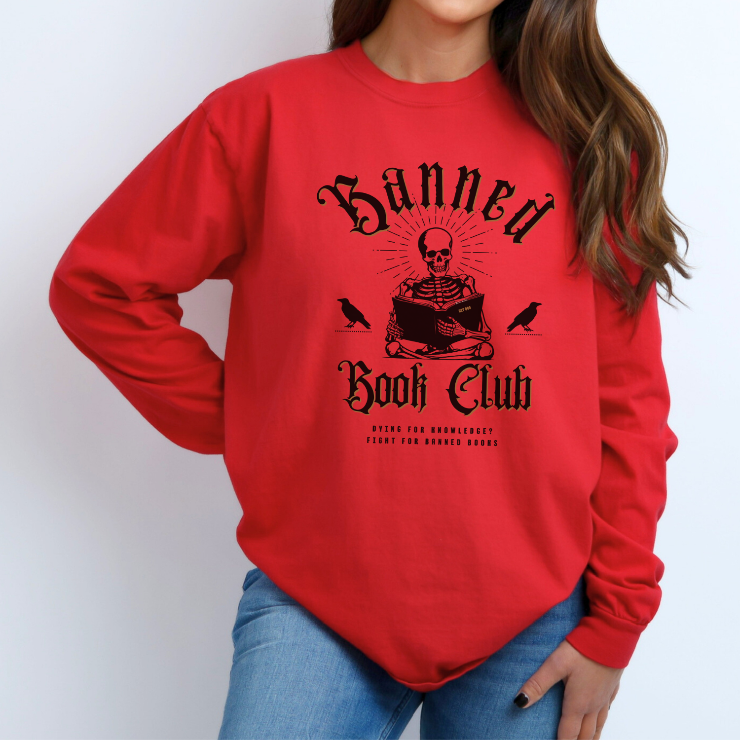 Red - Banned Book Club Comfort Colors long-sleeve t-shirt for reading lover. Has a spooky graphic of a skeleton reading and says "Dying for knowledge? Fight for banned books."  Perfect gift for avid readers, literary enthusiasts, English majors and librarians.