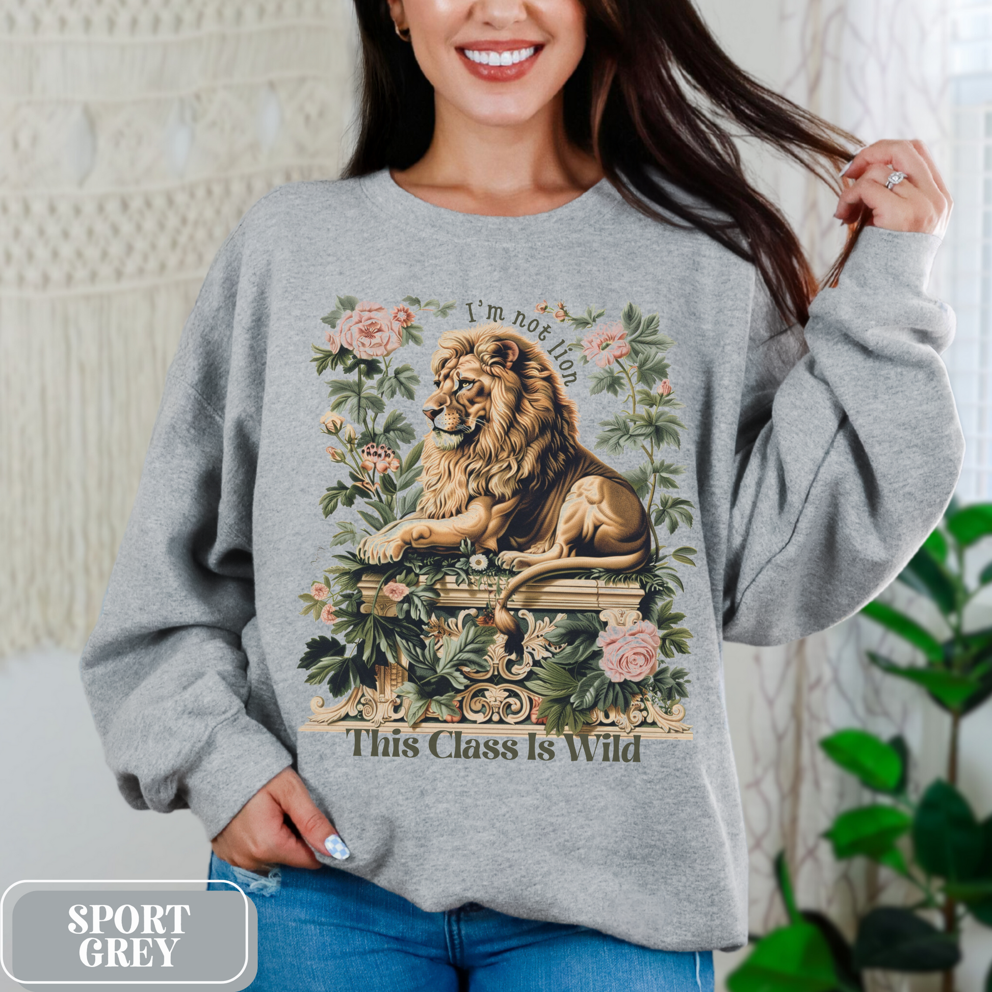 Sport Grey Gildan 18000 Sweatshirt with a large Lion graphic with beautiful flowers that says "I'm Not Lion, This Class Is Wild" - perfect gift for teachers, educators, and education majors.